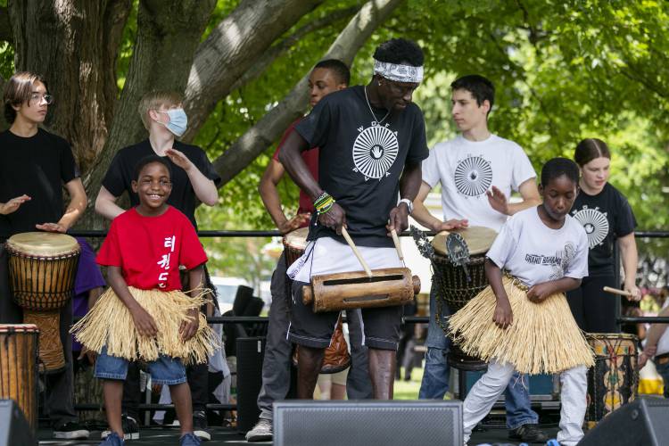 Alpha Kabisko Kaba leads a spirited performance with the Pioneer Valley Performing Arts School’s African Dance and Drum Company
